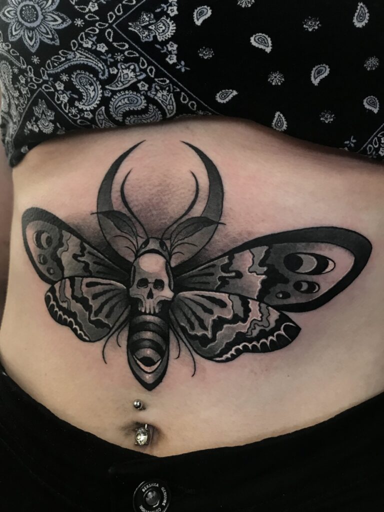 Skull buterfly tattoo
