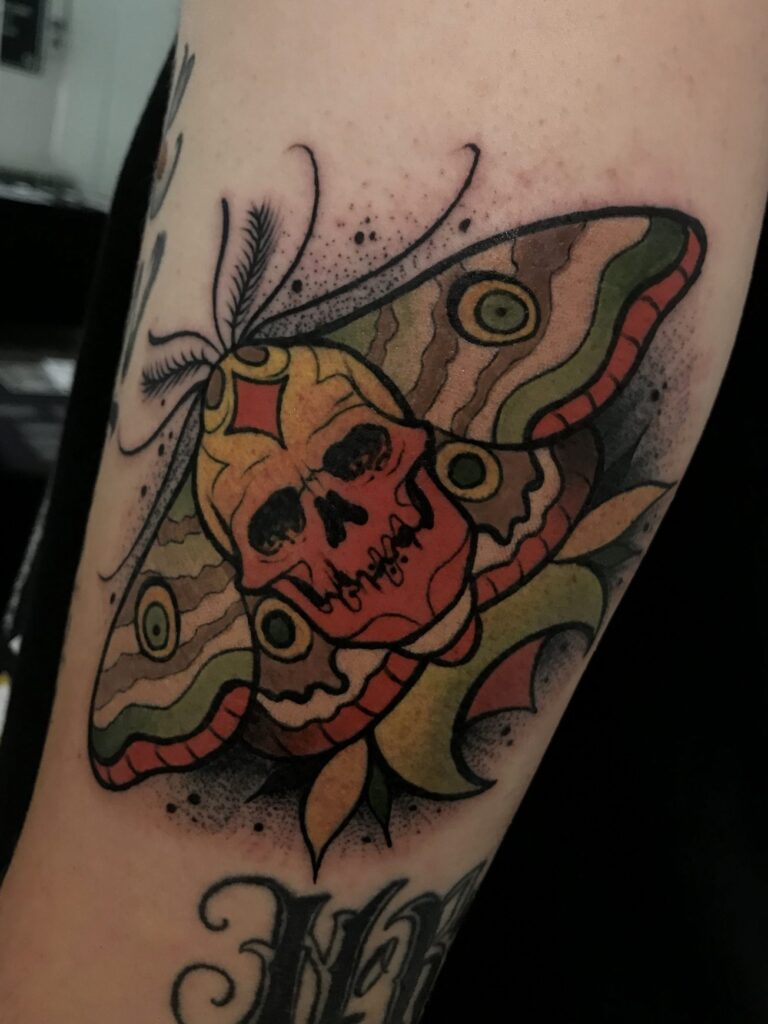 Skull butterfly tattoo